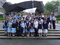 Four secondary schools in Homantin -  Chan Sui Ki (La Salle) College, Hoi Ping Chamber of Commerce Secondary School, Wah Ying College YWCA Hioe Tjo Yoeng College having a group photo with reference librarians after visiting the book exhibition